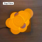 Top view of LED Floating Cloud Lamp with warm yellow lighting.