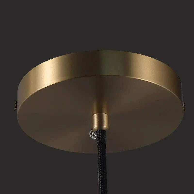 Raindrop Pendant Lights with modern gold fixture design.