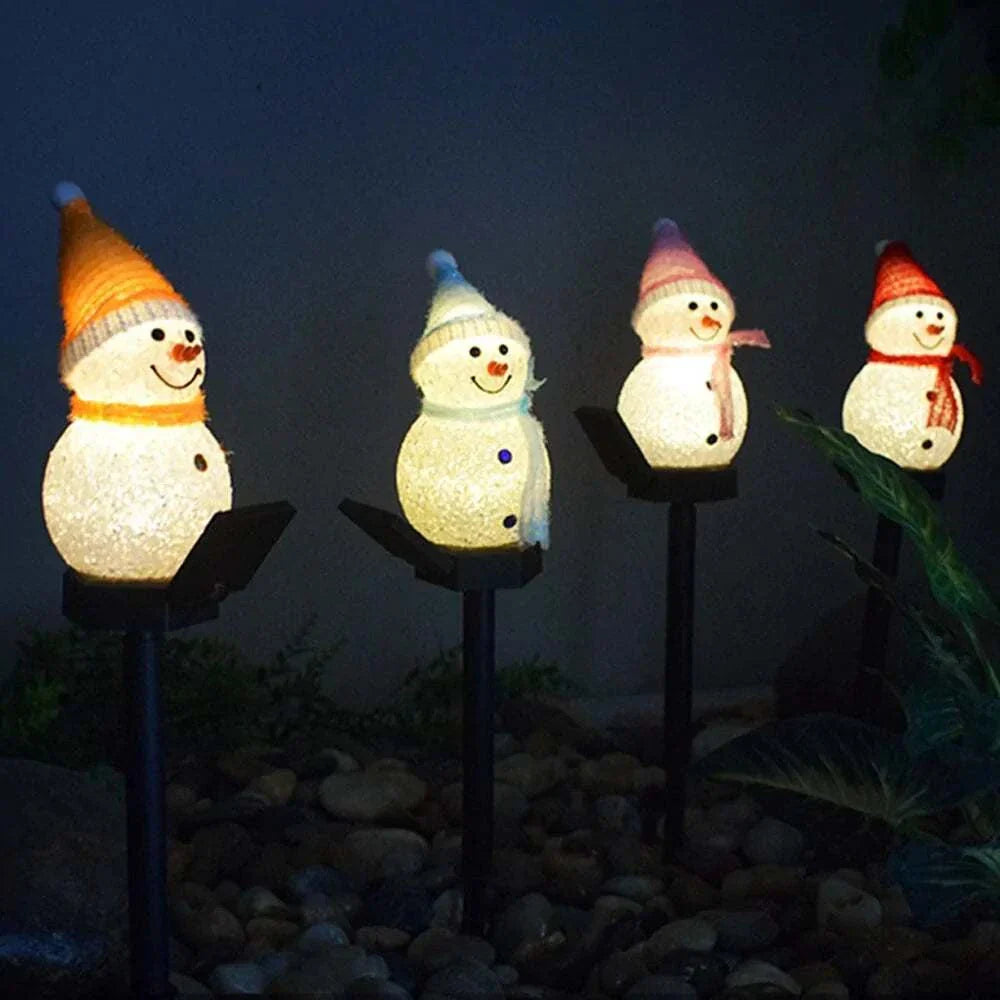 Solar Christmas lights snowman illuminating outdoor space with warm glow.