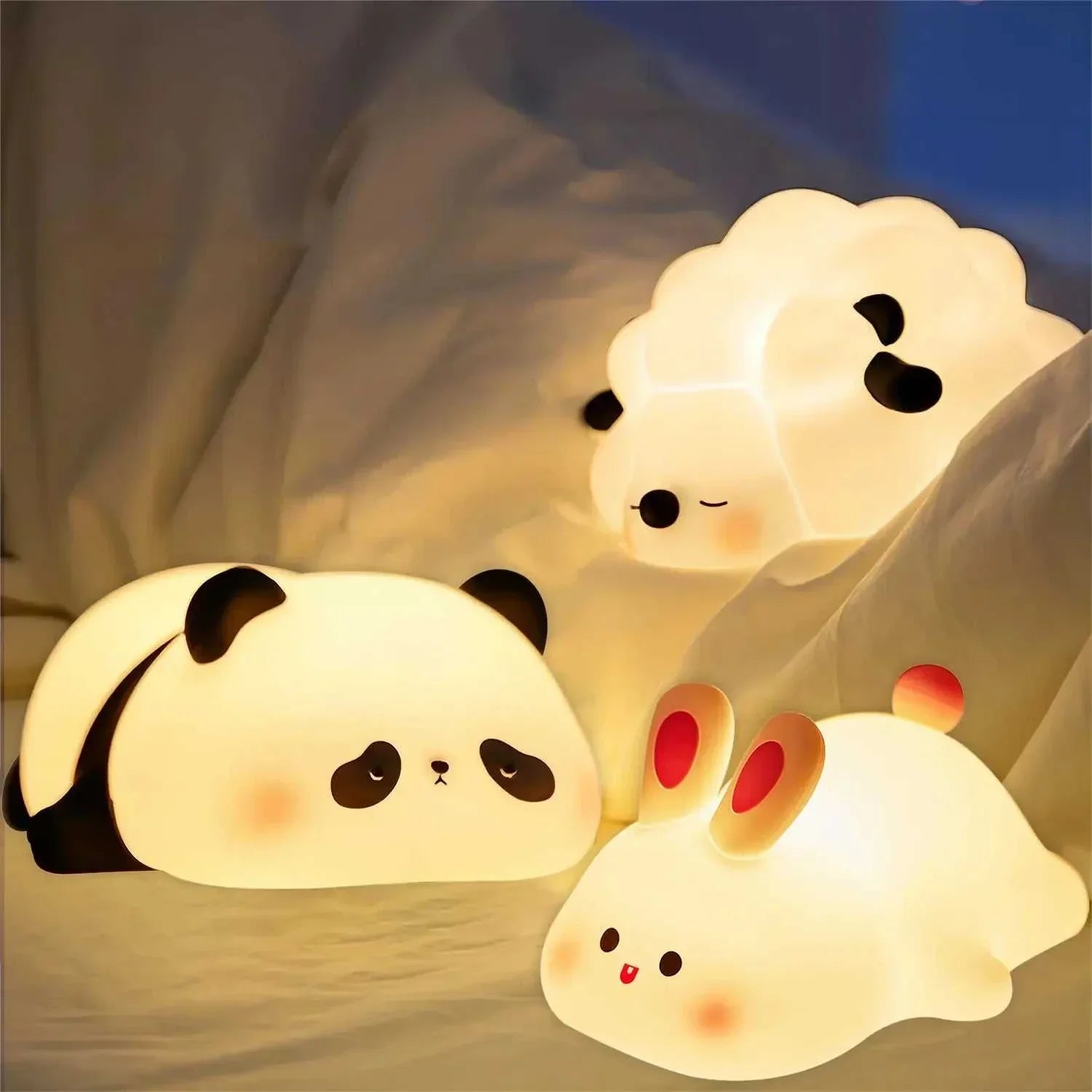 LED night lights featuring cute sheep and panda designs in a cozy setting.