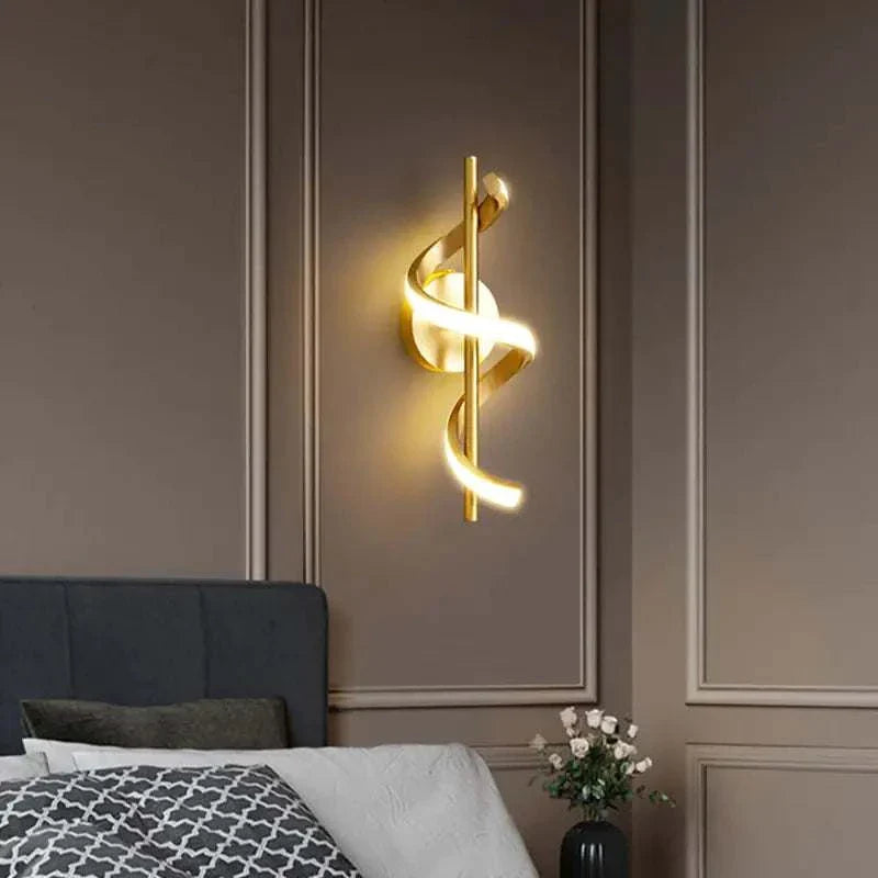 Nordic LED pendant light in elegant gold, illuminating a bedroom interior.