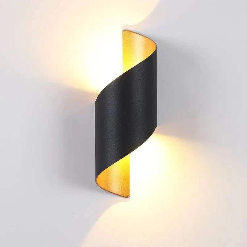 Marta LED Waterproof Outdoor Lighting illuminating a wall, featuring a stylish and durable design for gardens or patios.