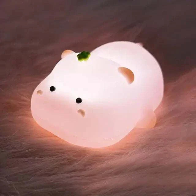 LED night light in the shape of a cute sheep, offering a warm and cozy glow, ideal for children's bedrooms.