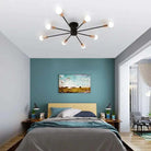 Splatter Chandelier in a modern bedroom setting; iron fixture with multiple bulb sockets casting a stylish glow.