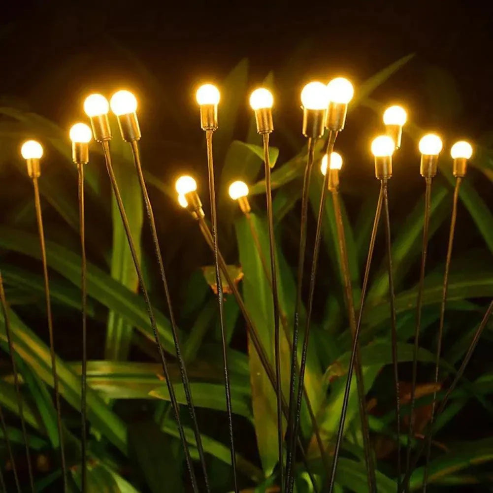 Solar Firefly Lights illuminating outdoor space with warm, enchanting glow.