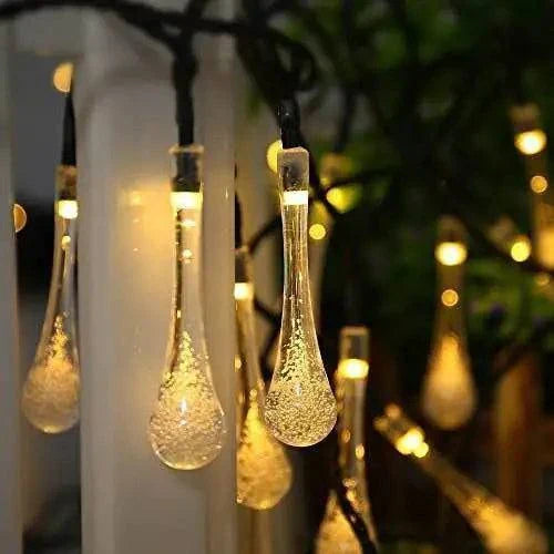 Garden solar lights with dewdrop-inspired LED bulbs, illuminating outdoor spaces with solar power and various lighting modes.