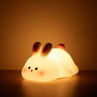 LED night light in the shape of a cute sheep panda, providing a soft, warm glow.