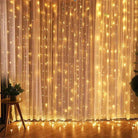 Christmas Lights Curtain Garland illuminating a room with warm LED glow.