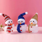 Solar Christmas lights snowman decorations with colorful scarves and hats.