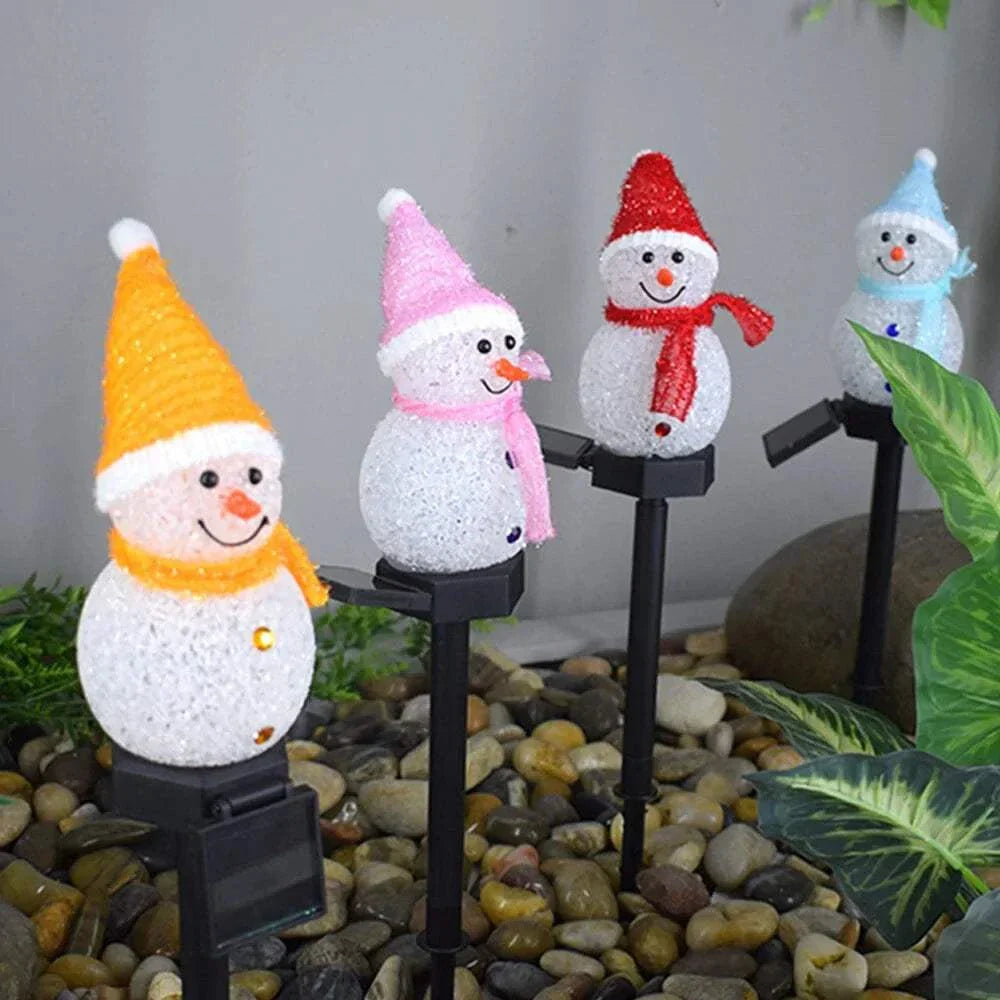 Solar Christmas Lights Snowman with colorful hats in garden display.