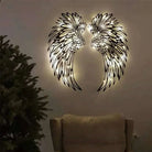 Angel Wings Wall Art with LED lights enhancing home decor ambiance.