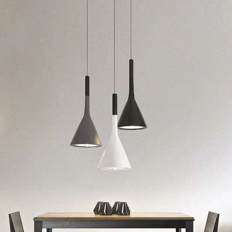 Sleek Funnel Pendant Lights above a dining table, adding a touch of modern elegance and warm glow.