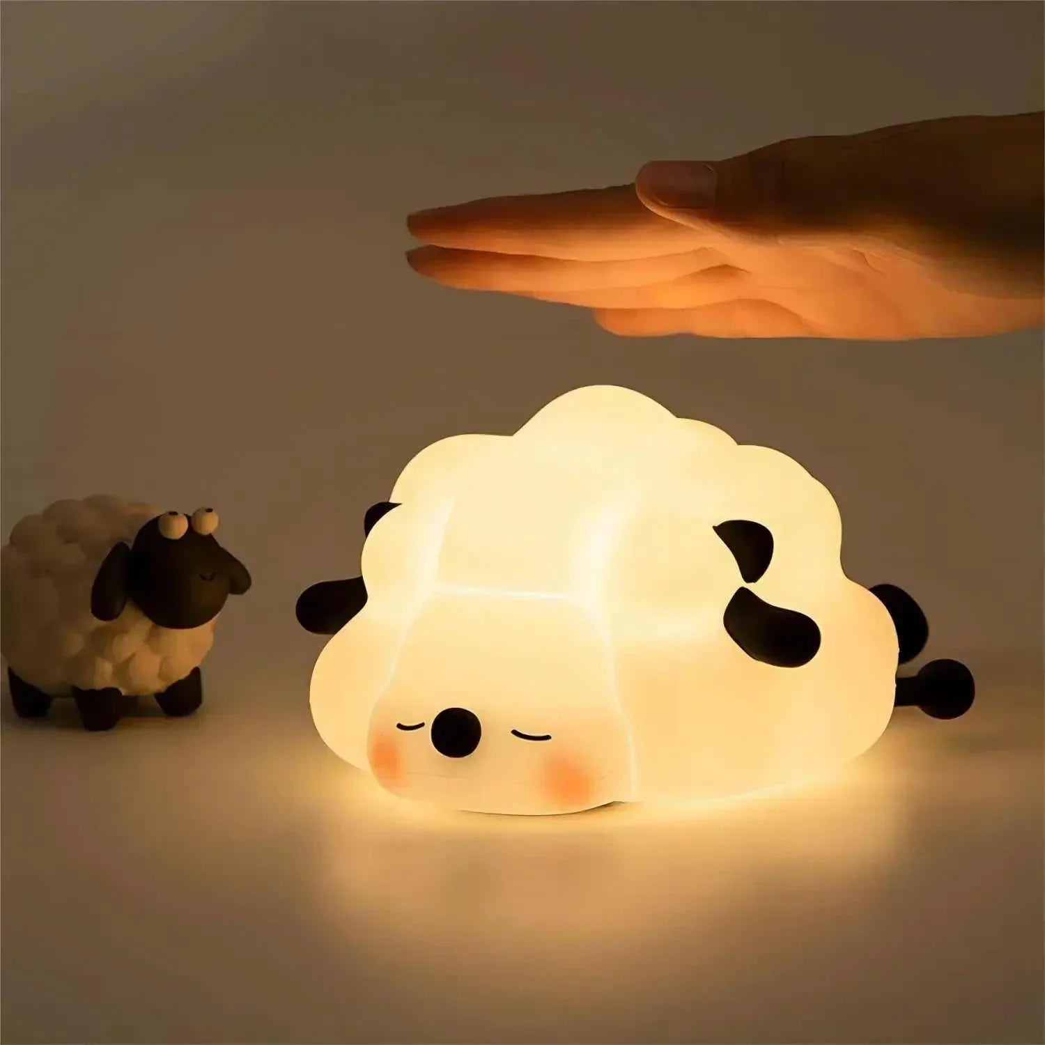 LED Night Lights Cute Sheep Panda Lamp illuminating softly in a dark room.