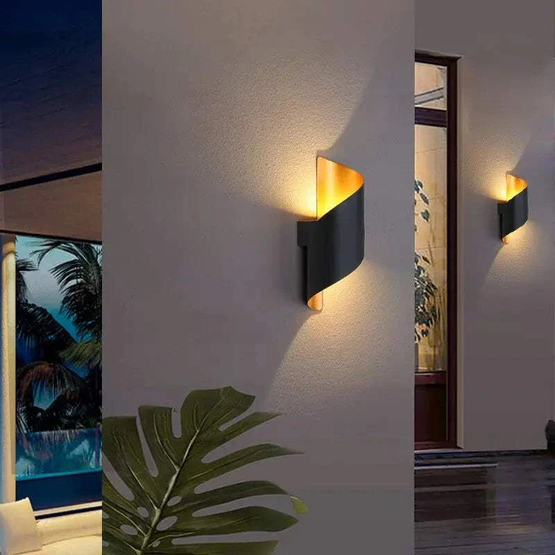 Marta LED waterproof outdoor lighting illuminating a garden and patio.