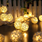 Enchanted fairy orb lights glowing warmly against a rustic backdrop.