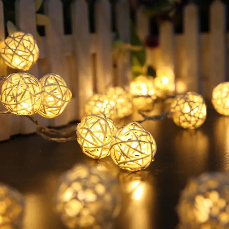 Enchanted fairy orb lights glowing warmly against a rustic backdrop.