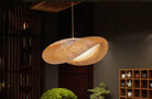 Eco-Chic Bamboo Pendant Light illuminating a room with elegant design.