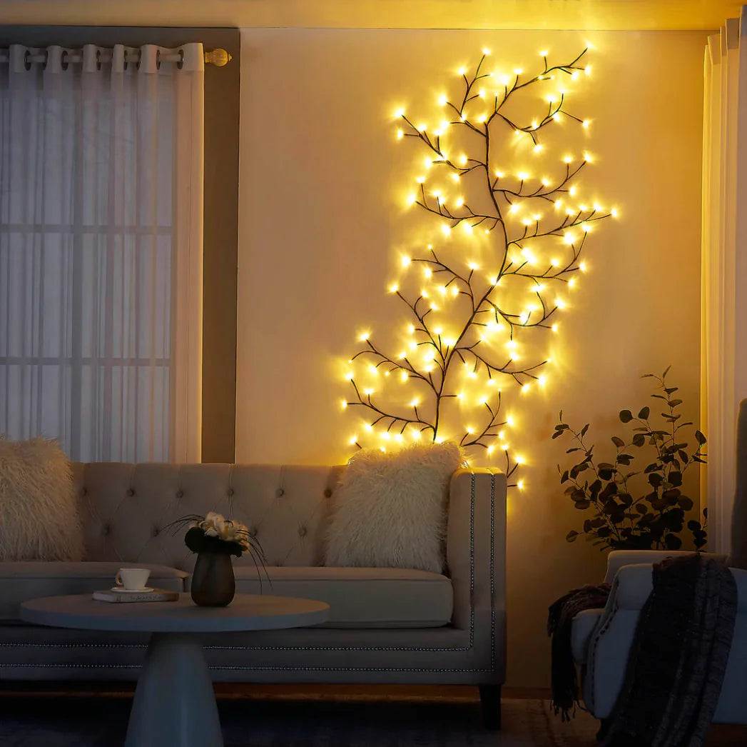 Vine-shaped ambient lights illuminating a cozy living room space.