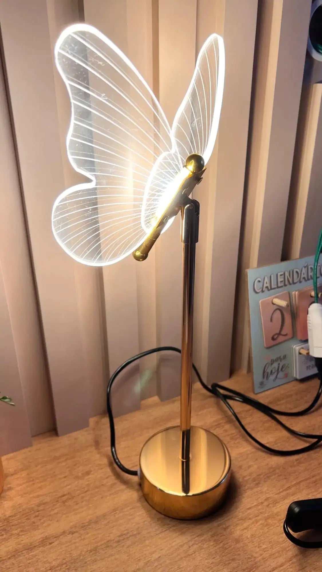 Golden Butterfly Lamp with elegant design on wooden table.