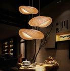 Eco-Chic Bamboo Pendant Lights illuminating a cozy, elegant room with rustic charm.