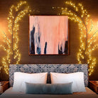 Vine-shaped ambient lighting decorating a bedroom wall.