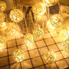 Fairy orb string lights with warm glow on table.