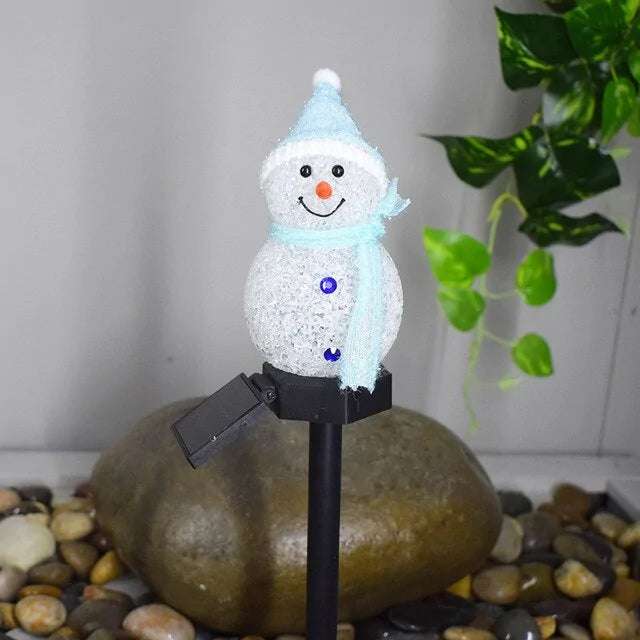 Solar-powered snowman light for eco-friendly outdoor decoration.