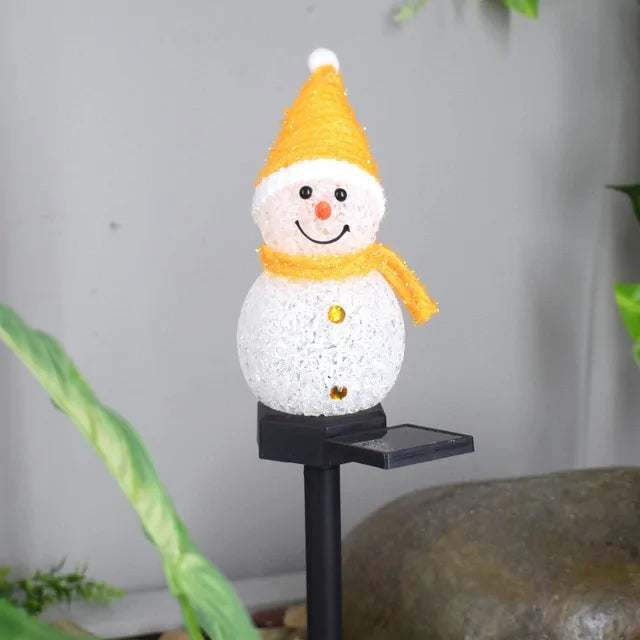 Solar-powered snowman light with a yellow hat and scarf, perfect for outdoor holiday decoration.