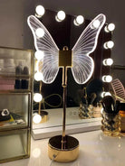 Golden Butterfly Lamp illuminating a vanity area with elegant lighting.