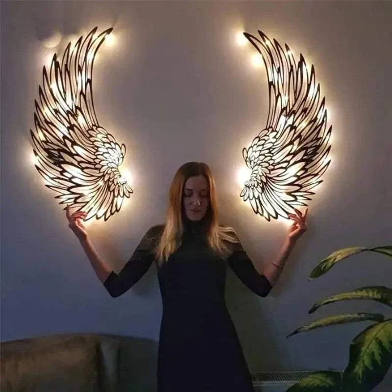 Angel Wings Wall Art with LED lights illuminating intricate wing details on a living room wall.