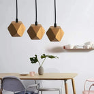 Wood pendant lights made of solid wood and metal, hanging above a dining table, perfect for living and dining rooms.