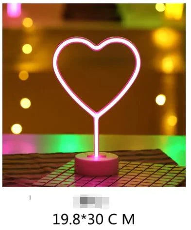 Heart-shaped LED neon light in vibrant pink, ideal for home or event decoration.